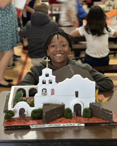 VCS elementary student presenting a model of Mission San Diego de Alcalá